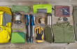 Gifts for outdoor enthusiasts Base Camp Magazine. A photo of outdoor gear spread out on the floor.